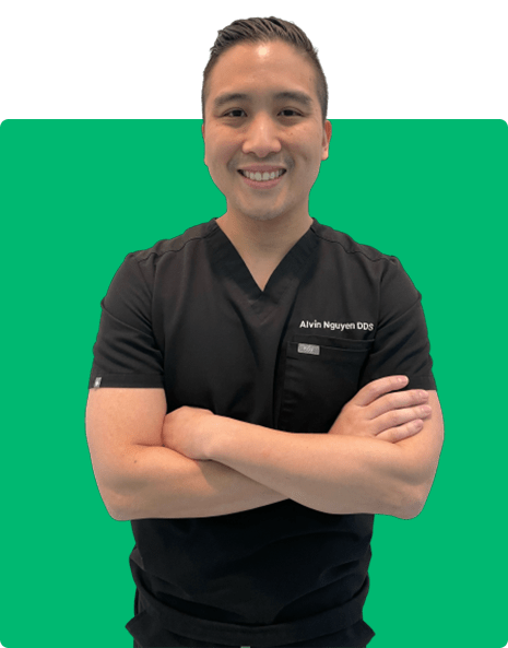 Dr. Alvin Nguyen smiling at the Fresh Dental Care dental office while crossing his arms